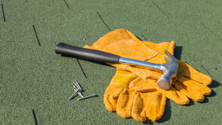 Hammer and nails on flat roof